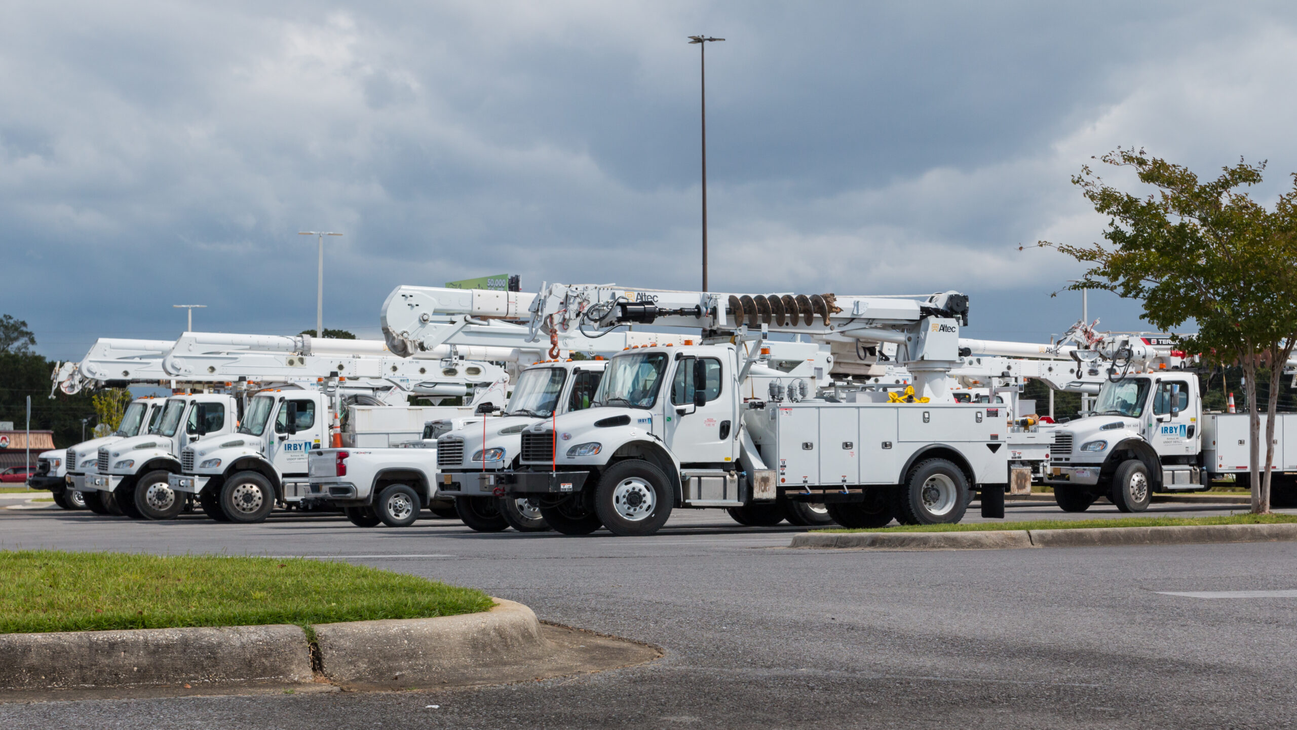 fleet of electric utility bucket trucks parked, representing tips for for electrification planning.